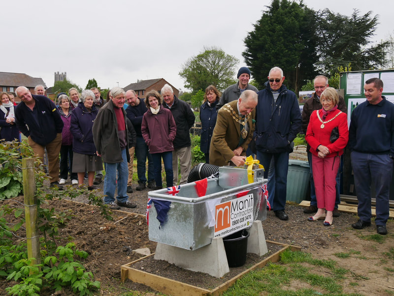The Mayor of Ely celebrates the water installation at three sites.